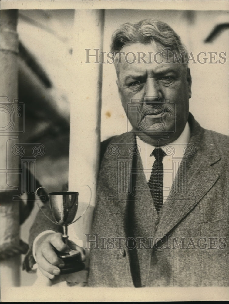 1924 Press Photo Dr. McCrane holding a trophy