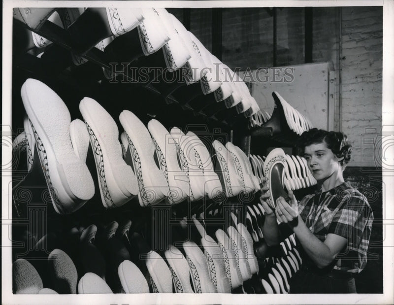 Load image into Gallery viewer, 1957 Press Photo Betty Arrid, conveyor operator at the B.F. Goodrich Footwear
