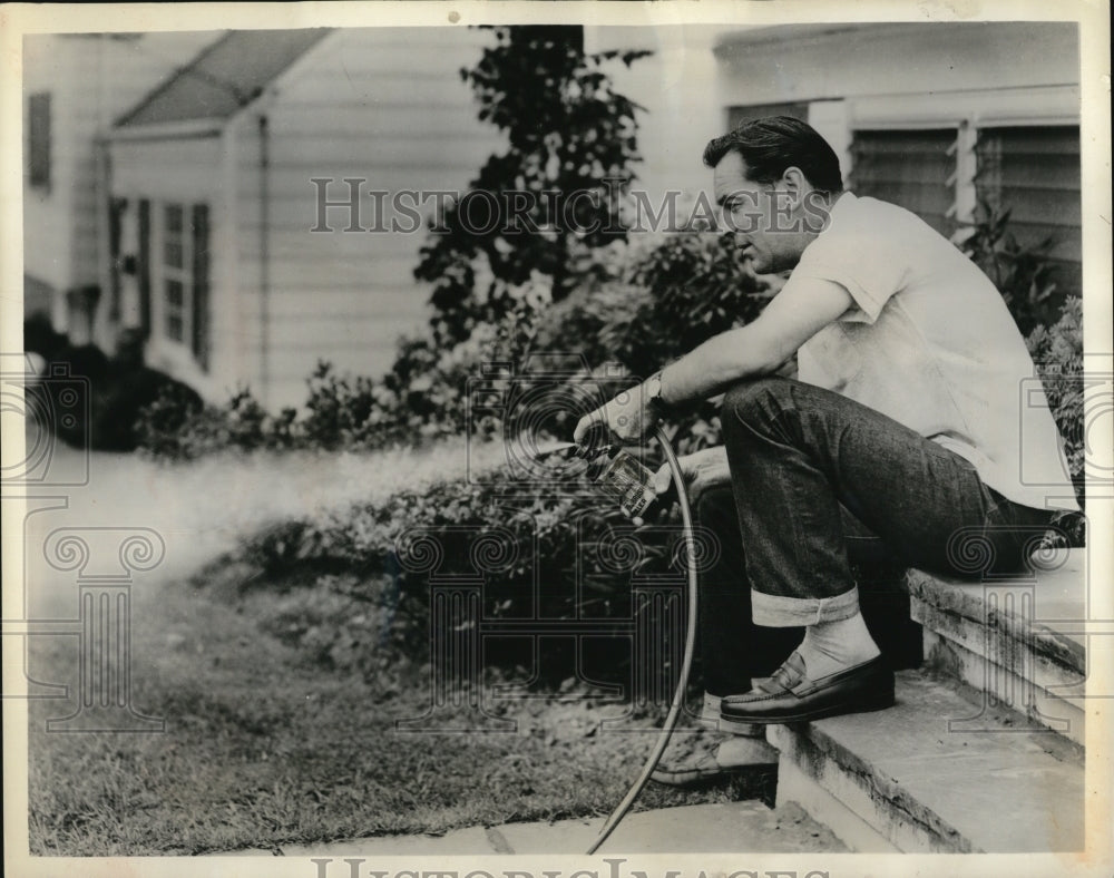 1959 Press Photo The gardener uses the Antrol Hose spray weed and brush killer