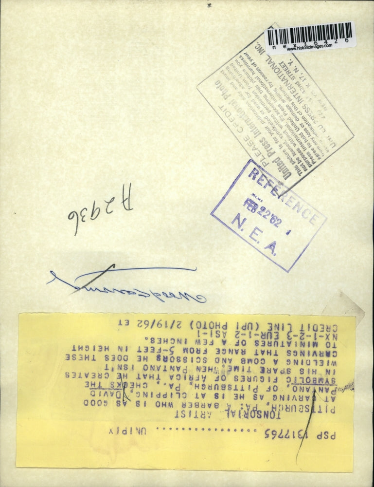 1962 Press Photo David Pantano of Pittsburgh Pa looking at symbolic figures