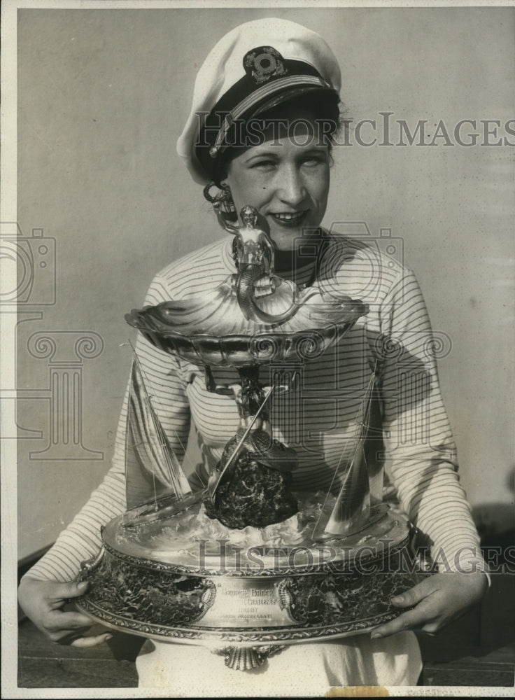 Load image into Gallery viewer, 1931 Press Photo Adrienne McKenzie holding the Gen Bruck Trophy
