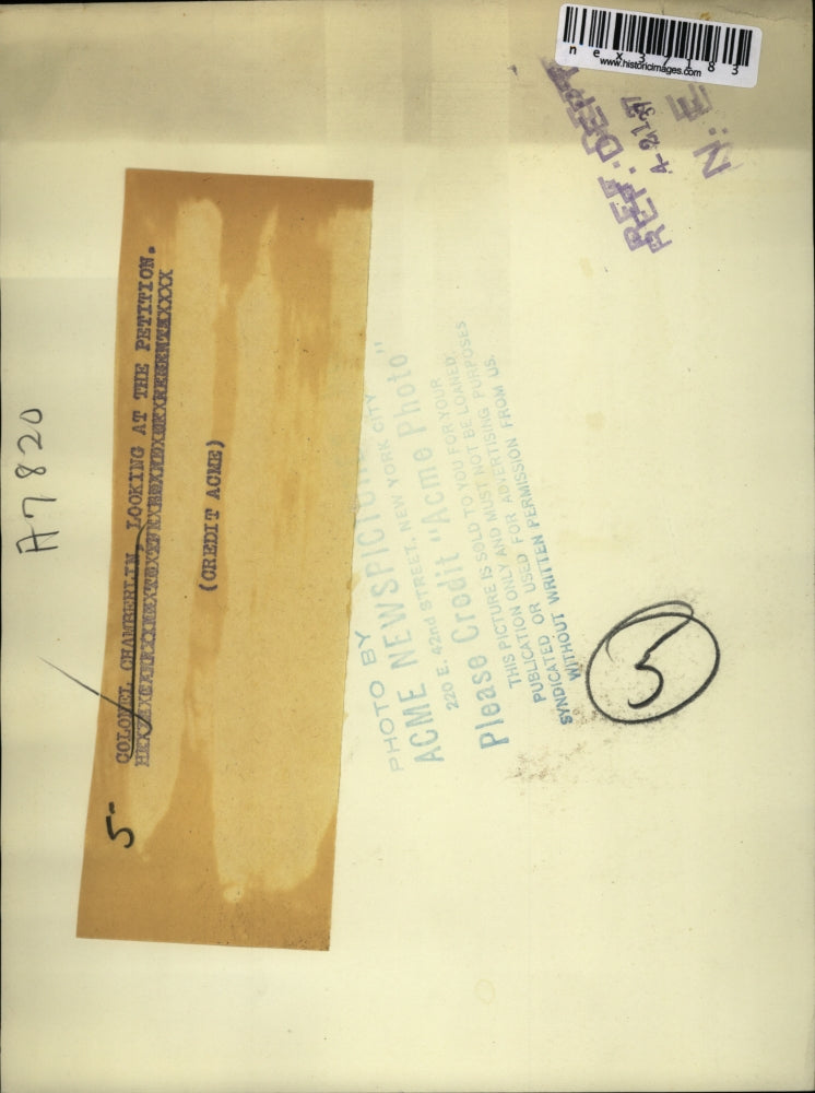 1937 Press Photo Colonel Chamberlin looking at petition