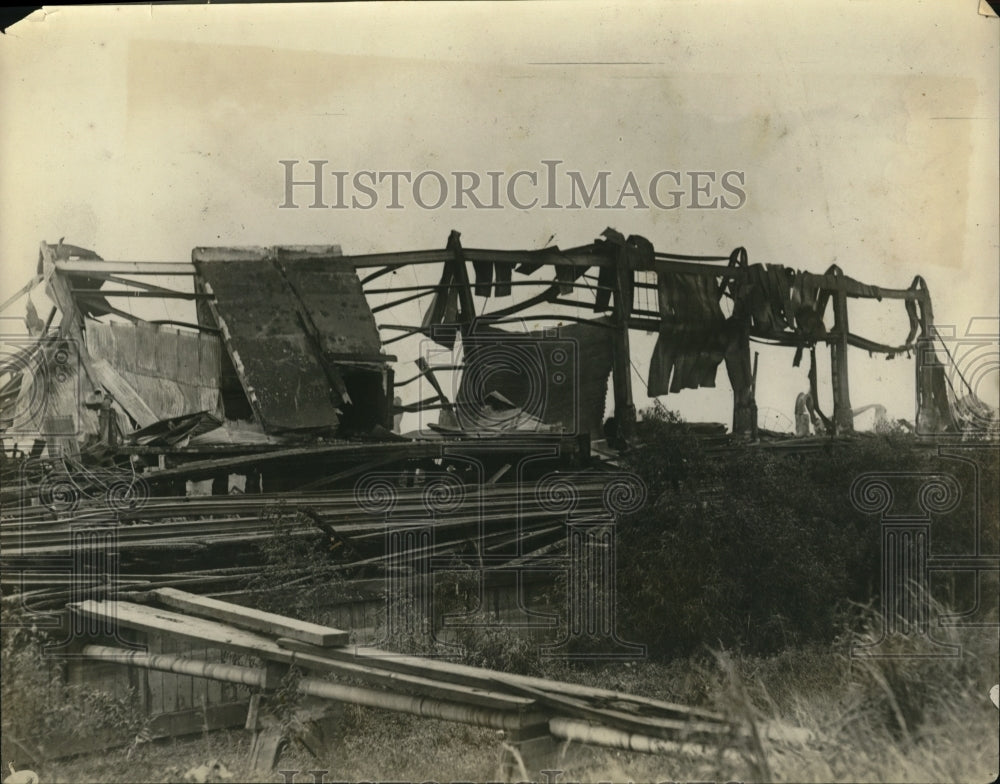 Undated Press Photo The wreckage of a government dock after a huge fire