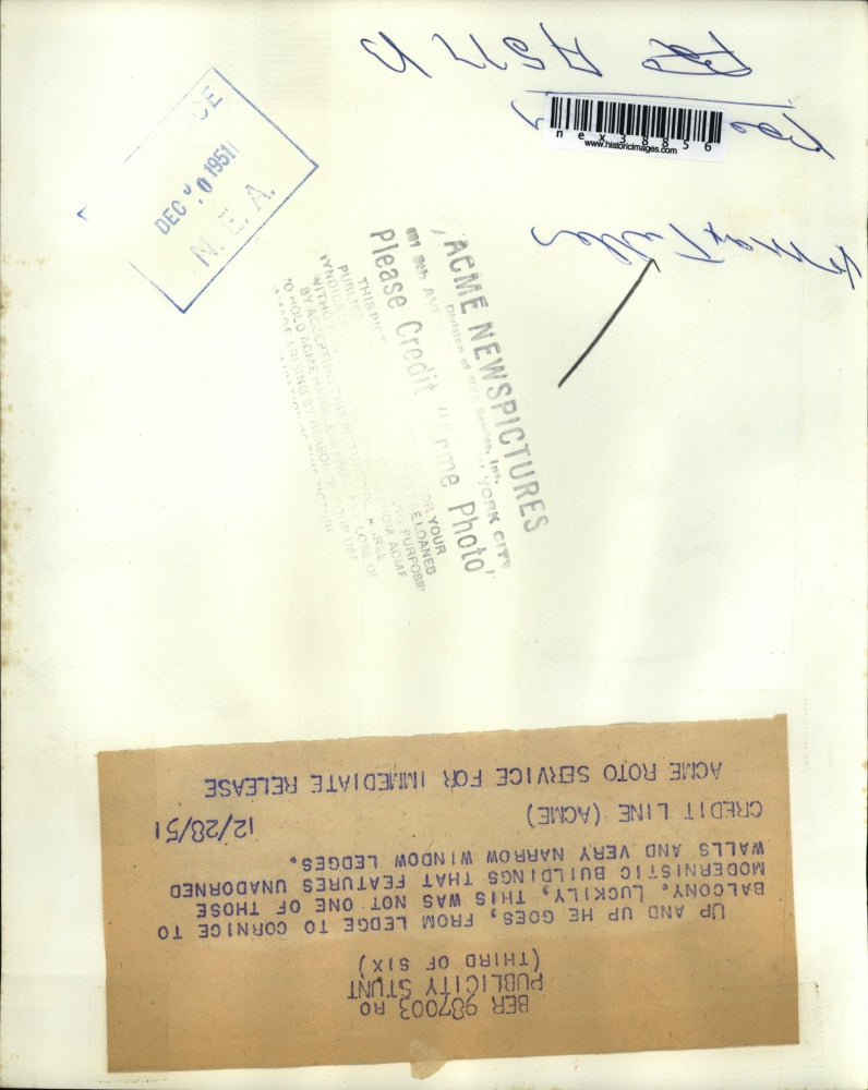 1951 Press Photo Publicity Stunt Max Tullen from ledge to cornice to balcony