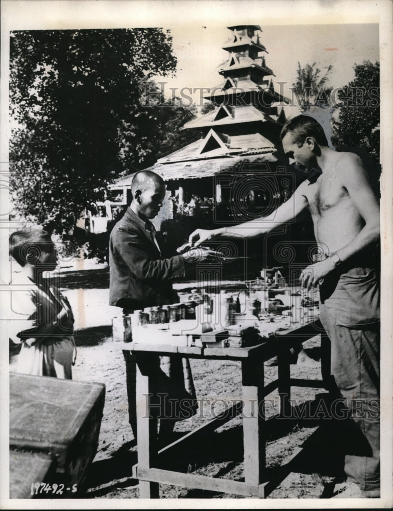 Load image into Gallery viewer, 1944 Press Photo Burma medical corpsman at a Buddhist monastery
