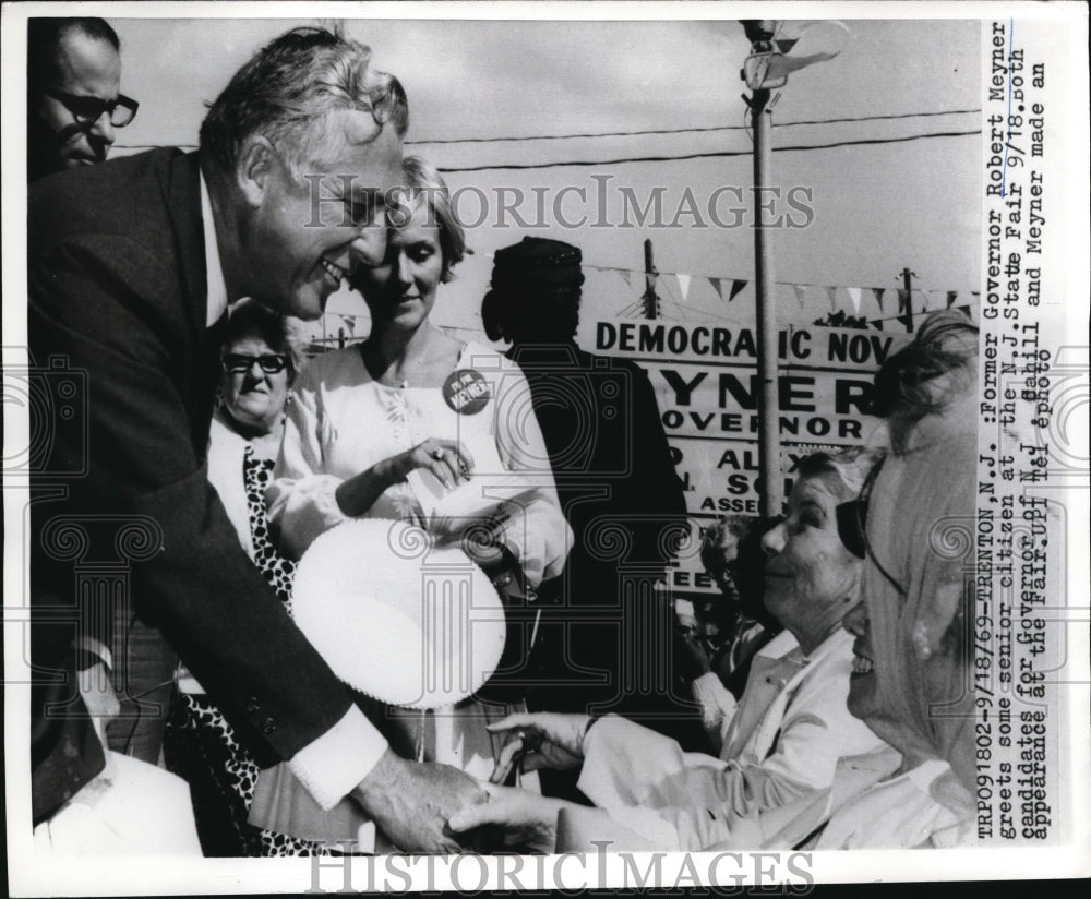 1969 Press Photo Former Governor of New Jersey, Robert Meyner greets some senior