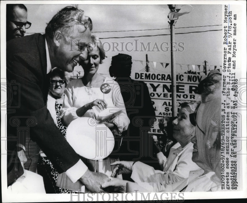 Load image into Gallery viewer, 1969 Press Photo Former Governor of New Jersey, Robert Meyner greets some senior
