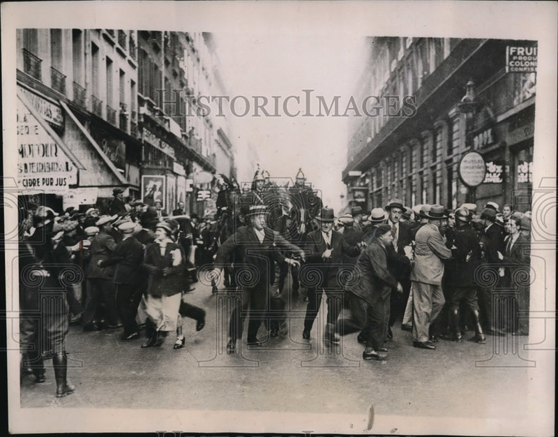 Load image into Gallery viewer, 1935 Press Photo Paris Police Quell Demonstrations Against Salary Cuts
