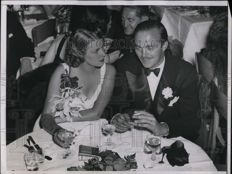Load image into Gallery viewer, 1937 Press Photo "Wooly" Donahue and Miss Edith Backus.
