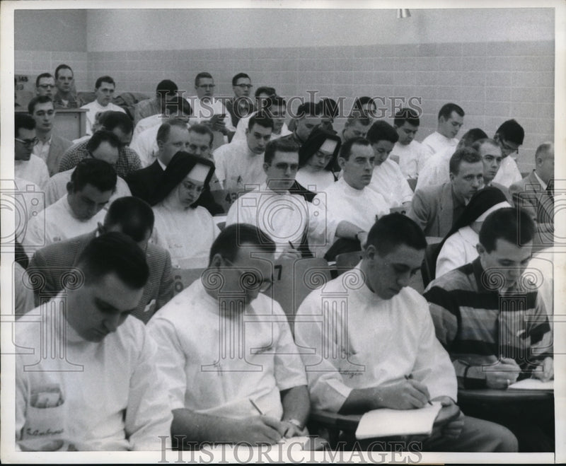 Load image into Gallery viewer, 1958 Press Photo Sisters Jessica, Florita and Christina during a class lecture
