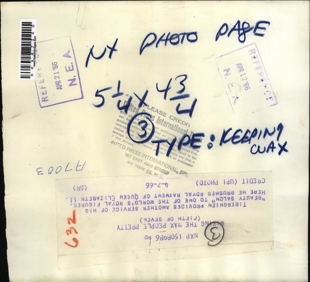 1966 Press Photo Tiberghien brushes royal raiment of Queen Elizabeth II