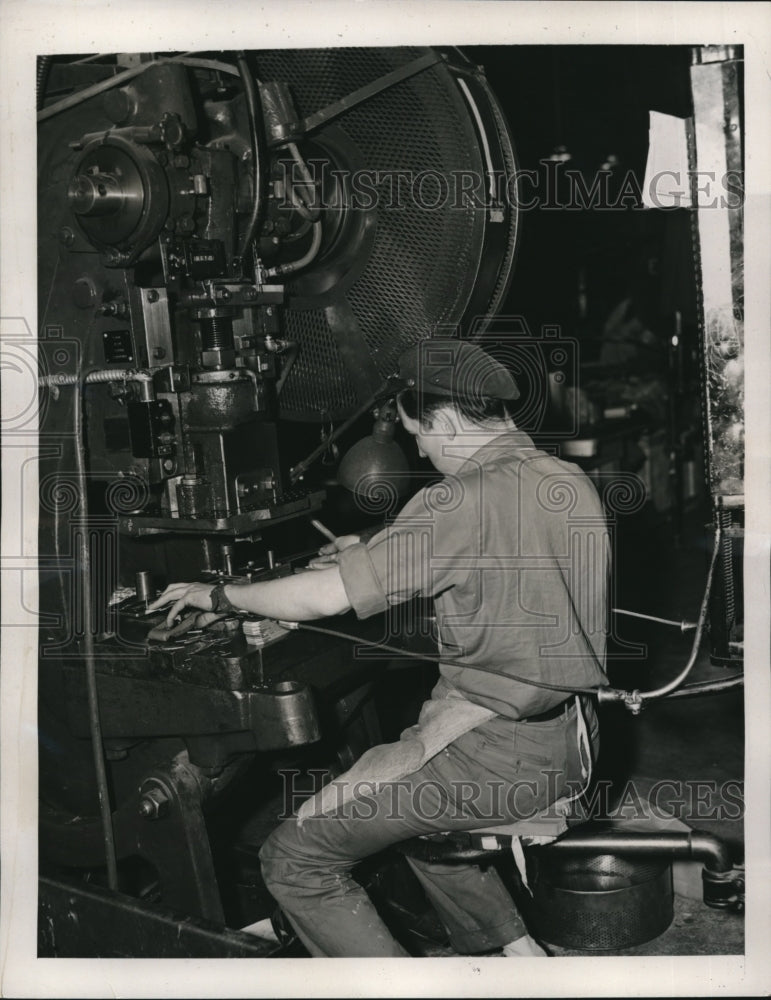 Load image into Gallery viewer, 1941 Press Photo Safety wrist guards are worn by press punch operators
