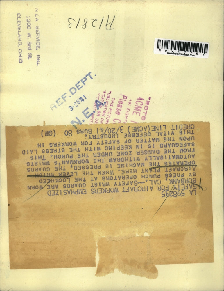 1941 Press Photo Safety wrist guards are worn by press punch operators