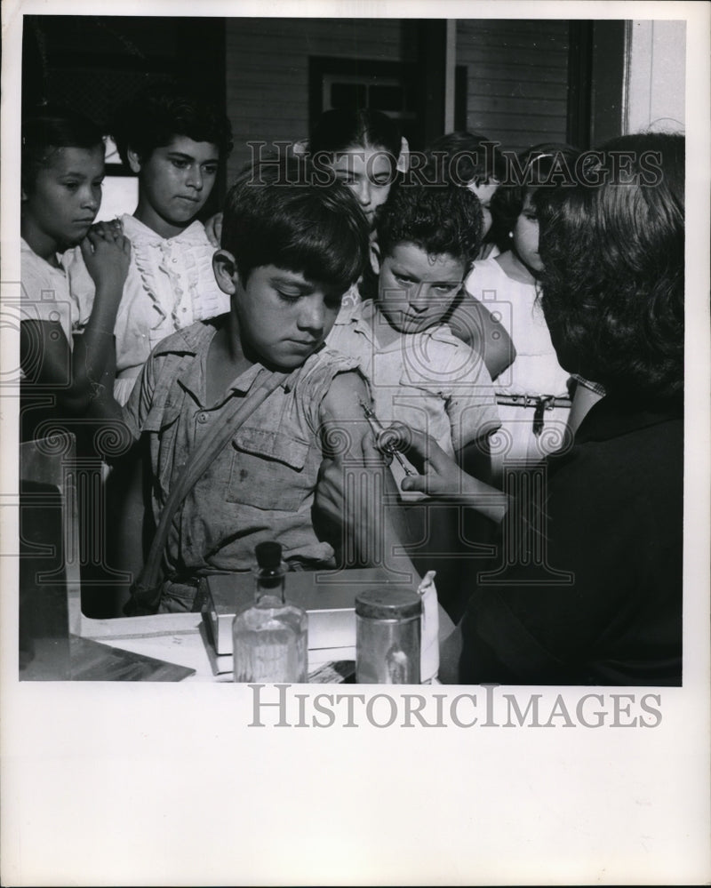Load image into Gallery viewer, 1957 Press Photo Luis Hugo getting anti-tuberculosis vaccine

