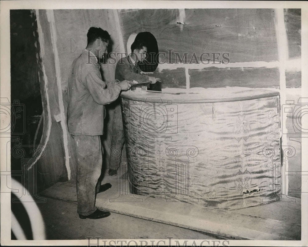 1938 Press Photo Workers Assembling Trans-Atlantic Plane Model, Paris Exposition