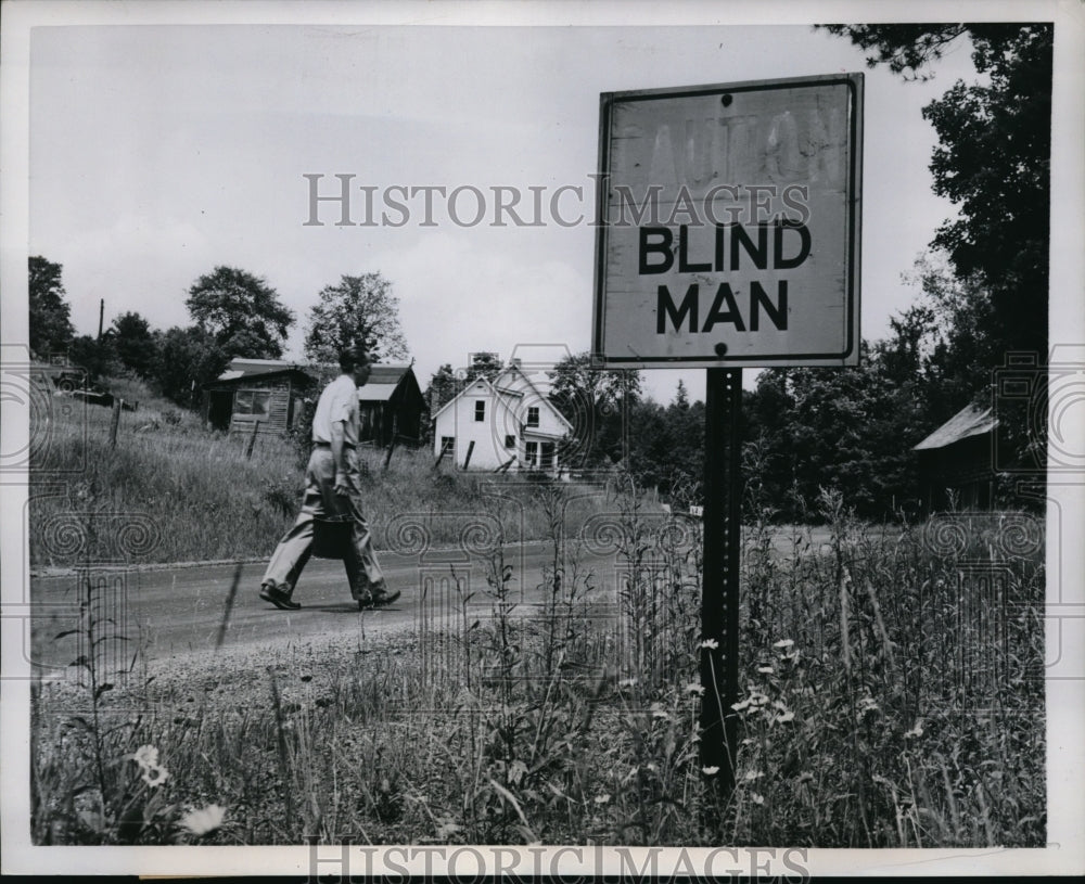 1957 Press Photo Horatio Hendrick walking to his chicken farm