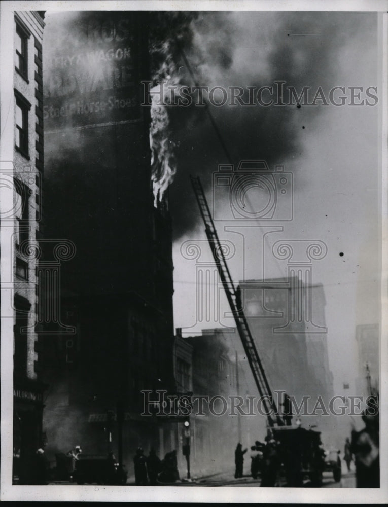 Load image into Gallery viewer, 1935 Press Photo Pittsburgh Pa firemen battle blaze in business district
