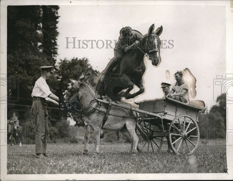 Load image into Gallery viewer, 1926 Press Photo A British AArmy rider jumps over donkey &amp; cart at a show
