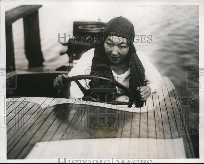 Load image into Gallery viewer, 1933 Press Photo Yoshi Tahn at wheel of her speed boat in LA Calif

