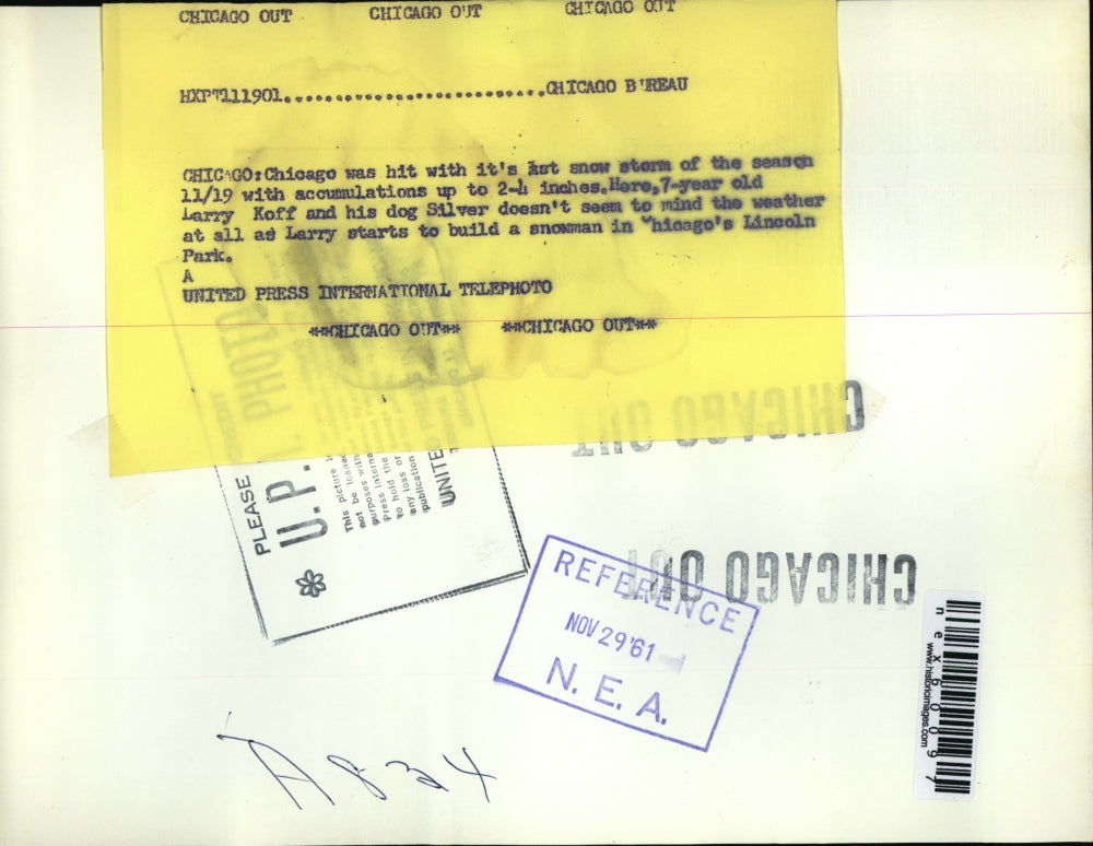 1961 Press Photo Chicago Ill Larry Koff & dog Silver play in snow