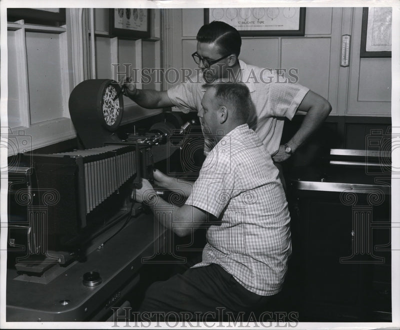 Load image into Gallery viewer, 1955 Press Photo Caterpillar Co Roy Beasimer &amp; Bill Cronk examine steel
