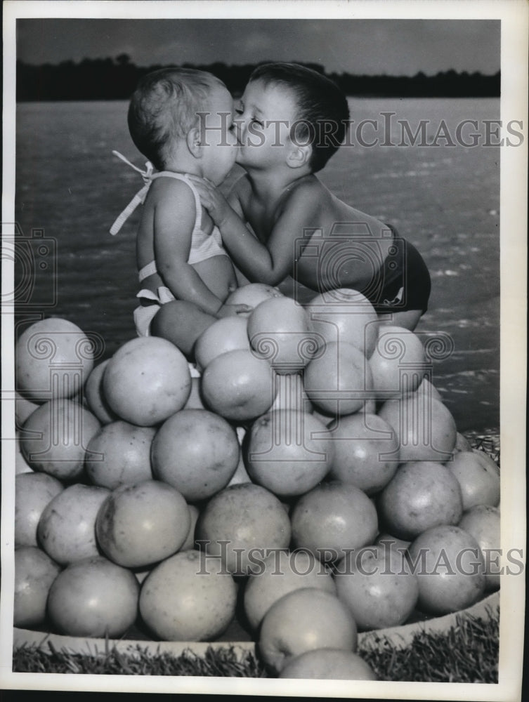 Load image into Gallery viewer, 1961 Press Photo Julieanna Pope receives a kiss from Jack Watkins
