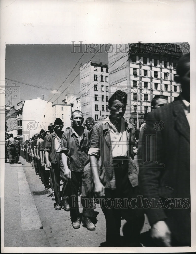 1948 Press Photo Yugoslav laborer, work 6 days then on sunday he marches off