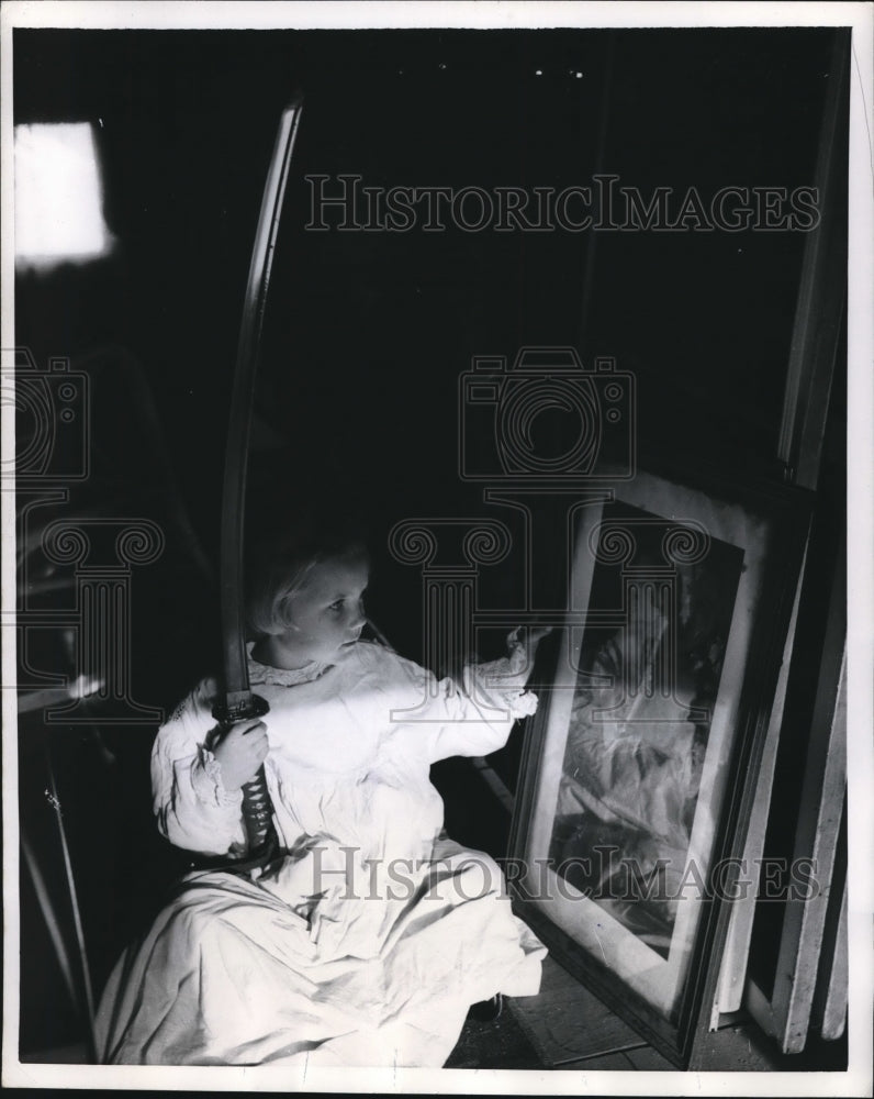 1956 Press Photo Sherry finds grandma's tarnished sword in Grandma's Attic