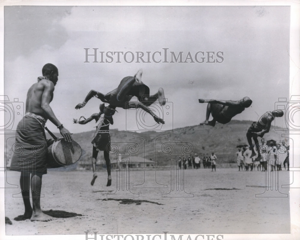 1956 Press Photo African Natives somersault wildly in the air