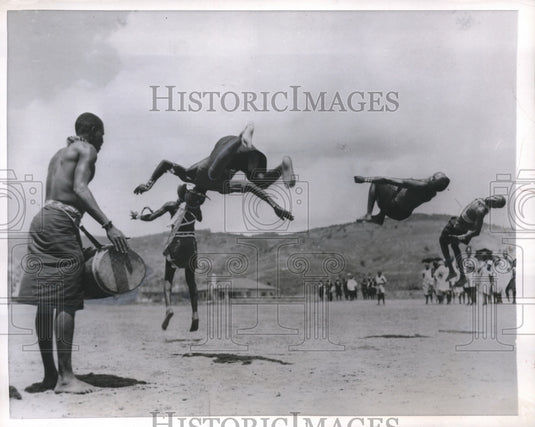 1956 Press Photo African Natives somersault wildly in the air