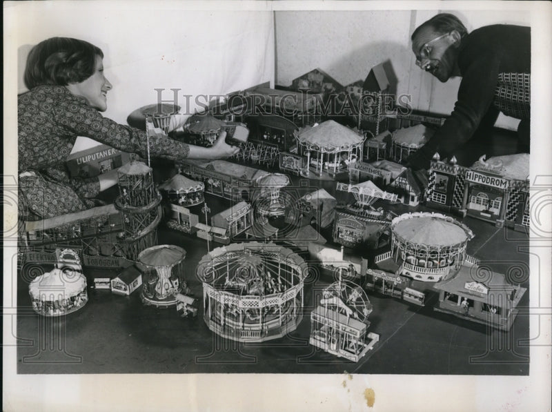 Load image into Gallery viewer, 1956 Press Photo Brigitte Wohlmann and father, Eduardo set up mini Oktoberwiesn

