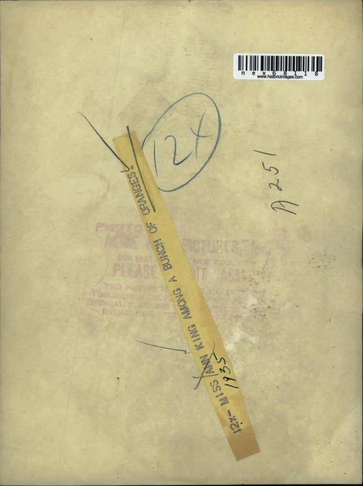 Press Photo Miss Ann King among a pile of oranges