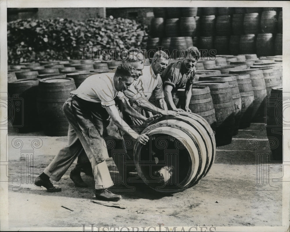 1923 Press Photo British men roll barrells Hernbert Gill