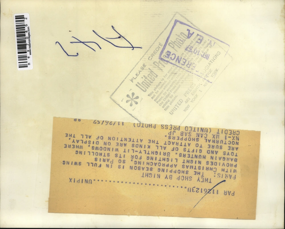 1957 Press Photo Paris France Christmas decorations on shops