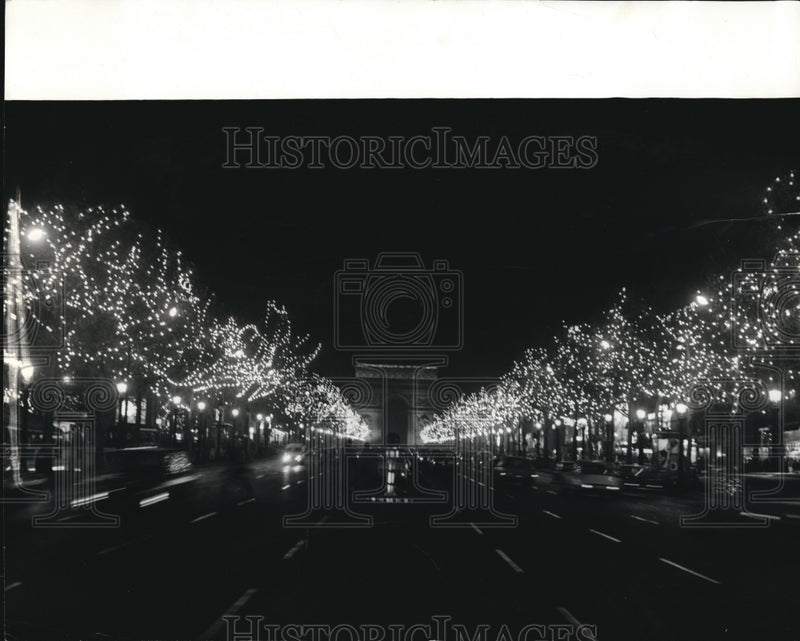 Load image into Gallery viewer, 1969 Press Photo Paris' famed Champs Elygees Avenue with Christmas decoration
