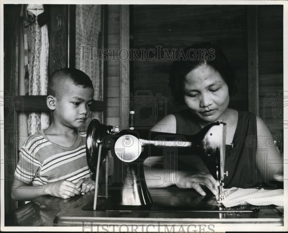 1969 Press Photo Pedro 's wife makes her children's clothes