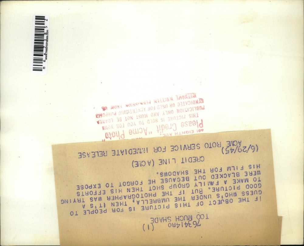 1945 Press Photo Sun umbrella in use at abeach