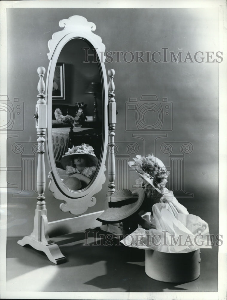 1962 Press Photo Young Miss trying some Newest Easter Bonnets for Holiday Parade