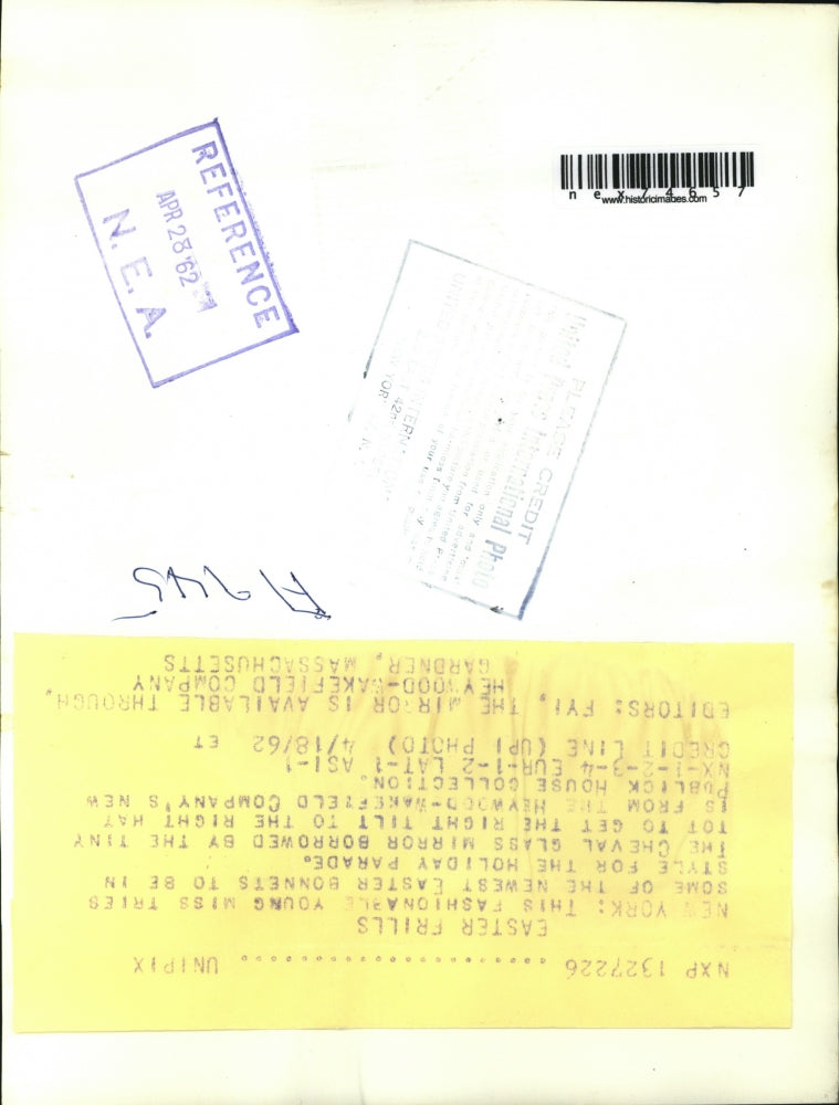 1962 Press Photo Young Miss trying some Newest Easter Bonnets for Holiday Parade