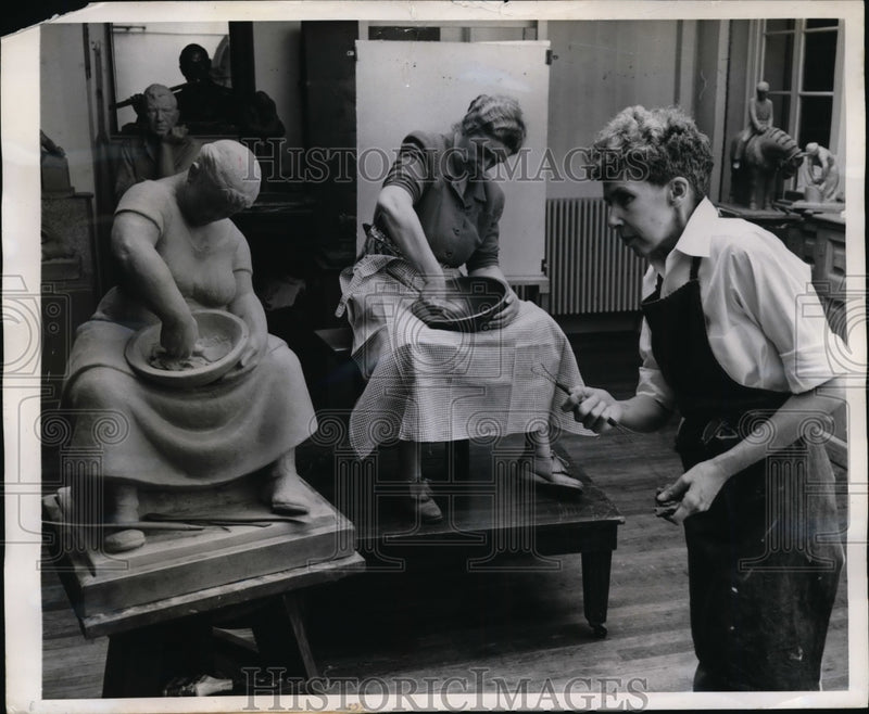 Load image into Gallery viewer, 1947 Press Photo Miss Marie Sanford Sculpting Woman Mashing Buttermilk to Butter
