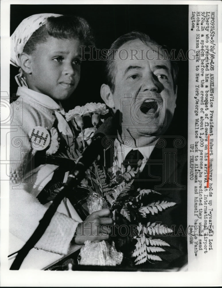 Load image into Gallery viewer, 1968 Press Photo Vice President Hubert Humphrey &amp; Lori Liberty Presnting Flowers
