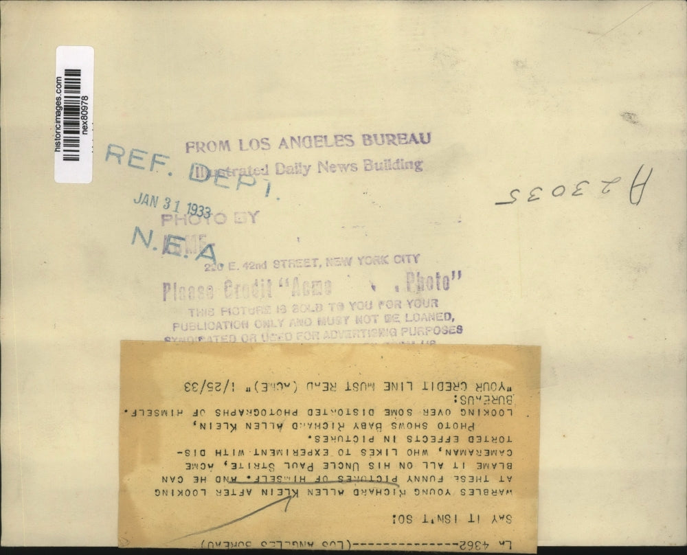 1933 Press Photo Richard Allen Klein Looking at Pictures of Himself