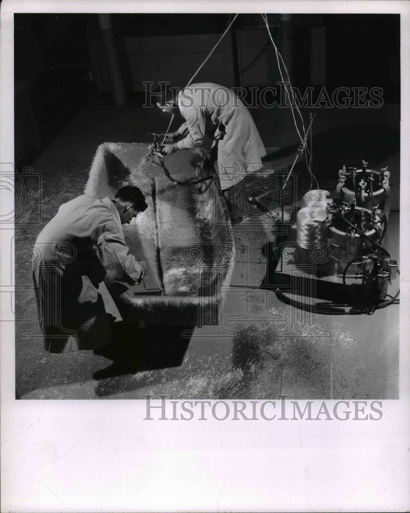 1958 Press Photo Rand Development Corp men work on aplastic boat