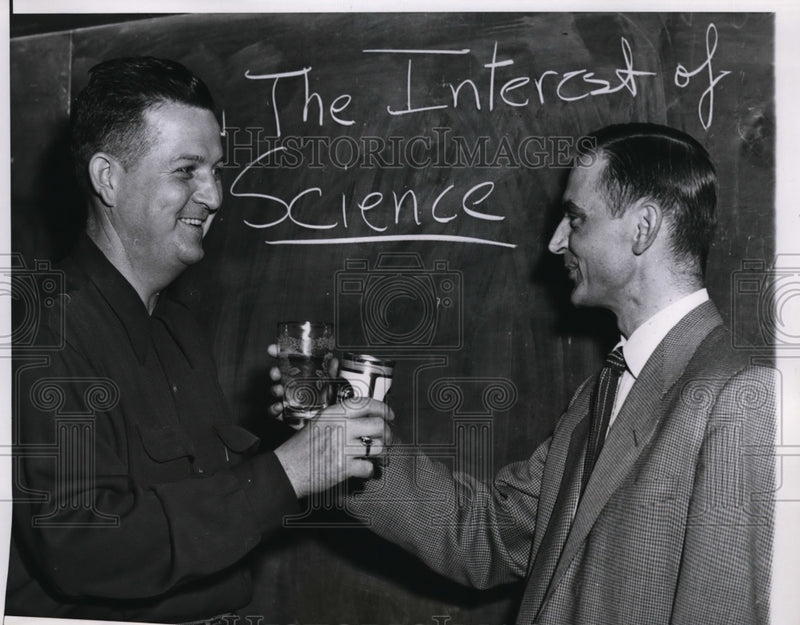 Load image into Gallery viewer, 1955 Press Photo Chicago Bruce Bergum &amp; Sgt William Harrell drink for science
