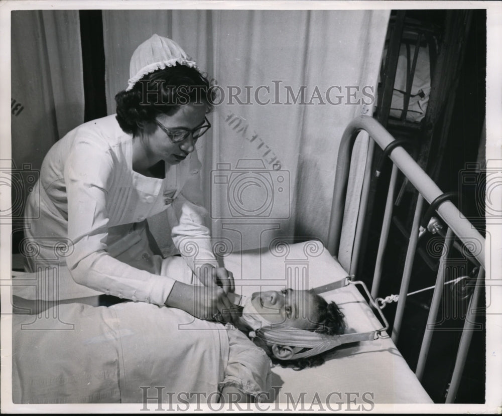 1950 Press Photo Patient Vivian treated for child arthritis by a nurse