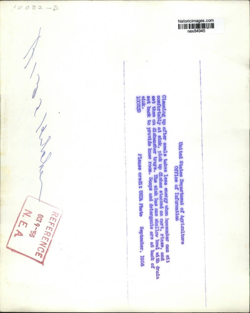 1956 Press Photo A hommemaker at kitchen sink with a dishwasher