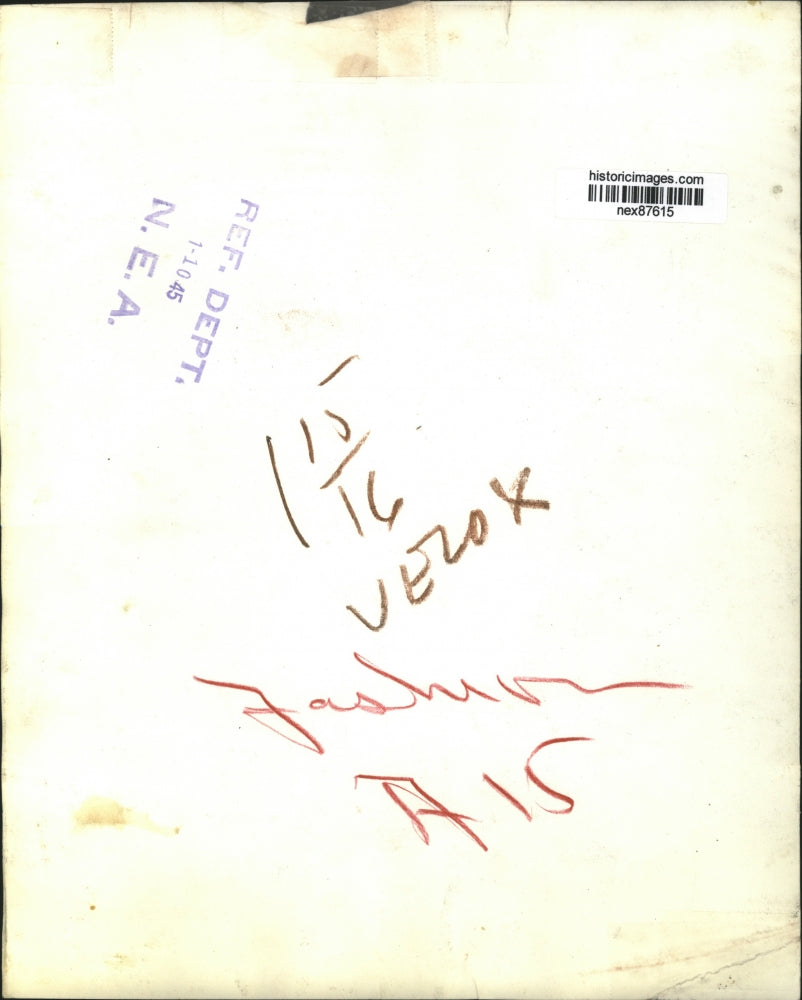 1945 Press Photo Model in Plaid Skirt and Matching Scarf and Wide Brimmed Hat