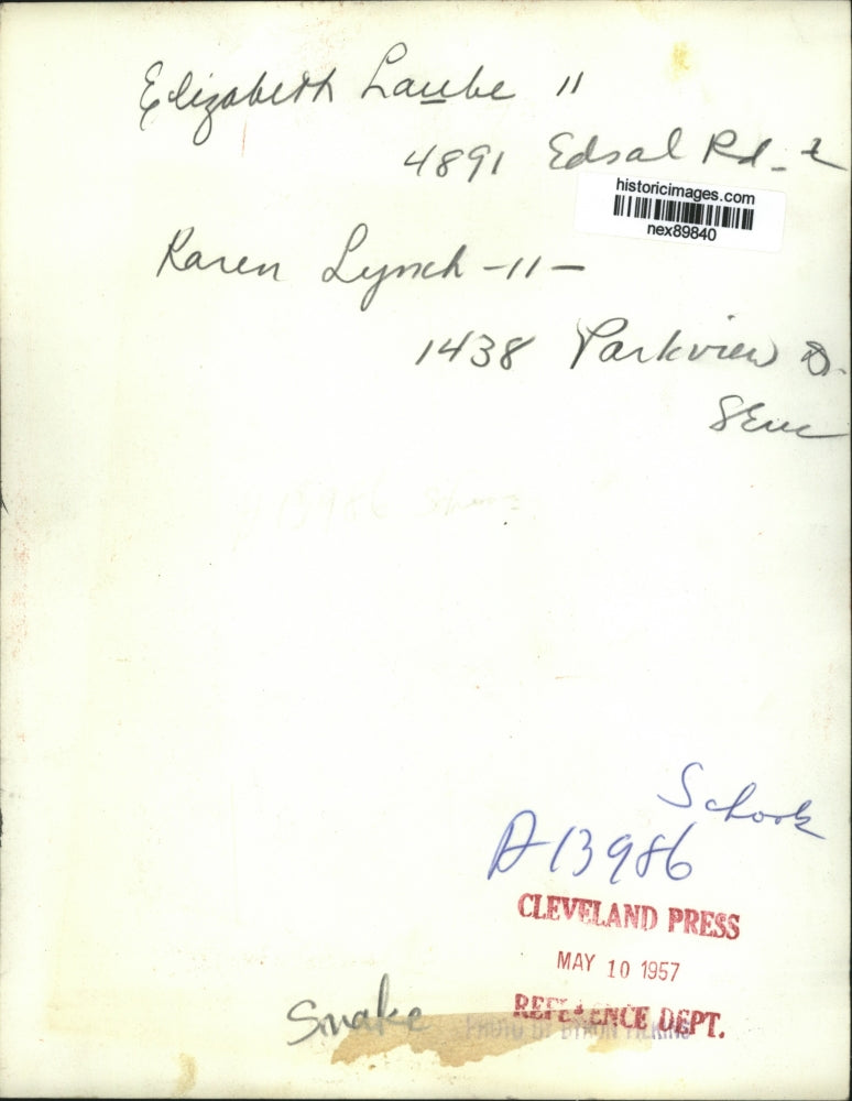 1957 Press Photo School Students Elizabeth Laube and Karen Lynch Hold Snake