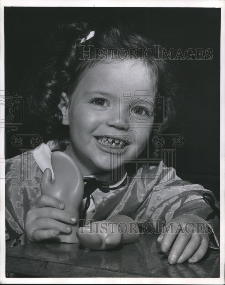 1958 Press Photo Little Girl Holds Mitten Hands