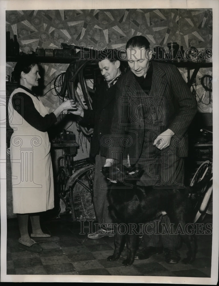 Load image into Gallery viewer, 1949 Press Photo Jules Hochepied Repairs Bicycles &amp; Trains Police Dogs
